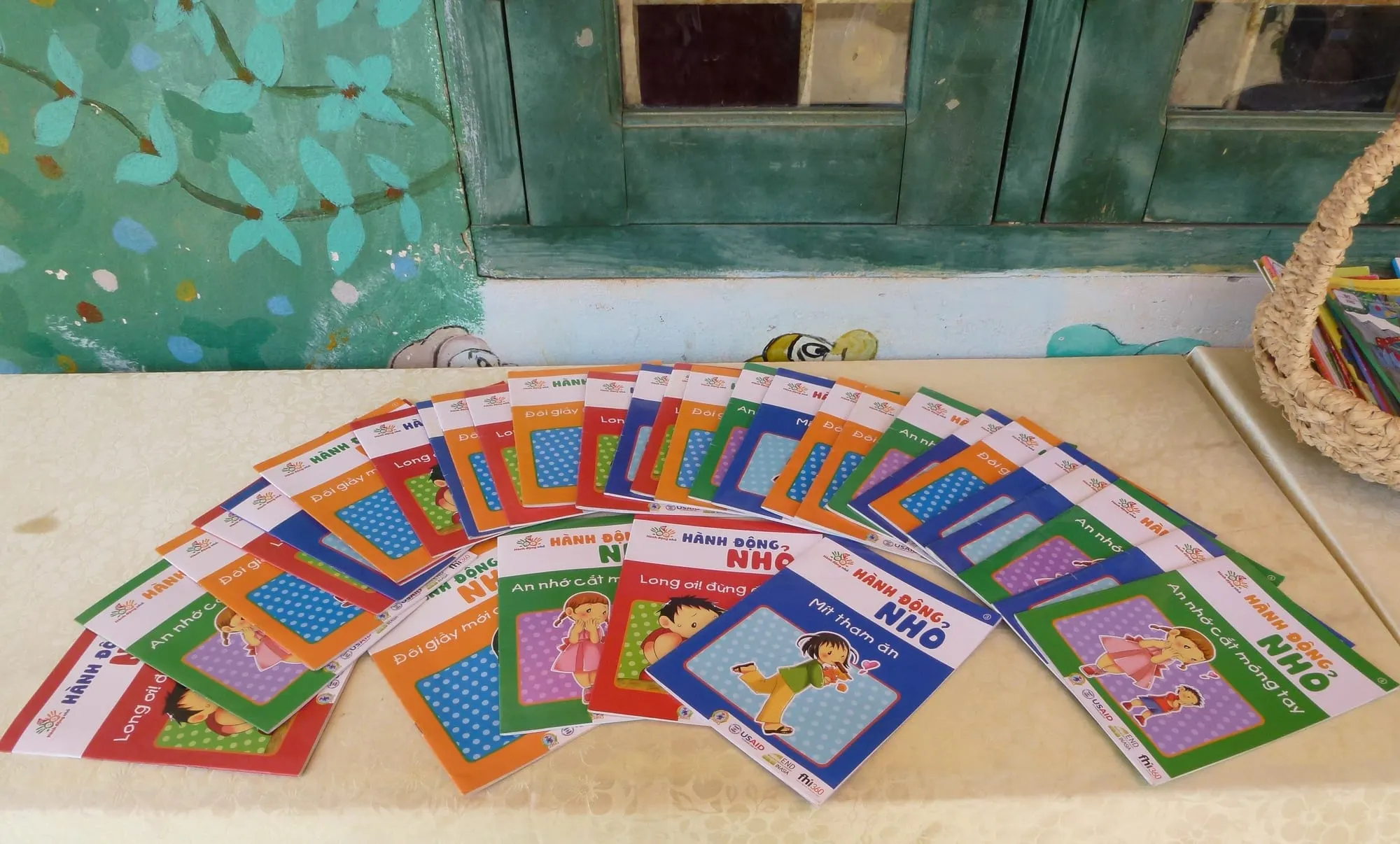 Colourful children's books fanned out on a table